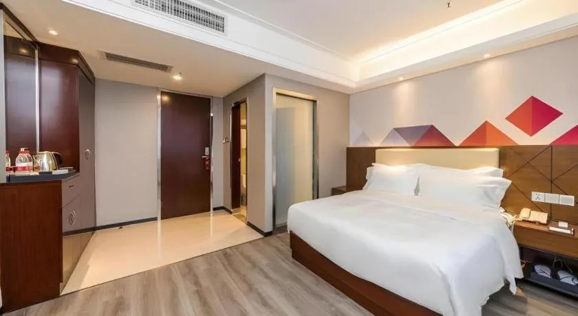 Bed in Borrman Hotel Guangzhou Railway Station Sanyuanli Metro Station