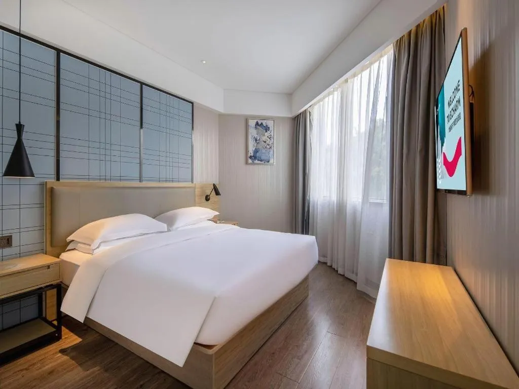 Bed in Echarm Hotel Nanning the MixC Exhibition Center Metro Station