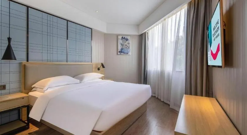 Bed in Echarm Hotel Nanning the MixC Exhibition Center Metro Station