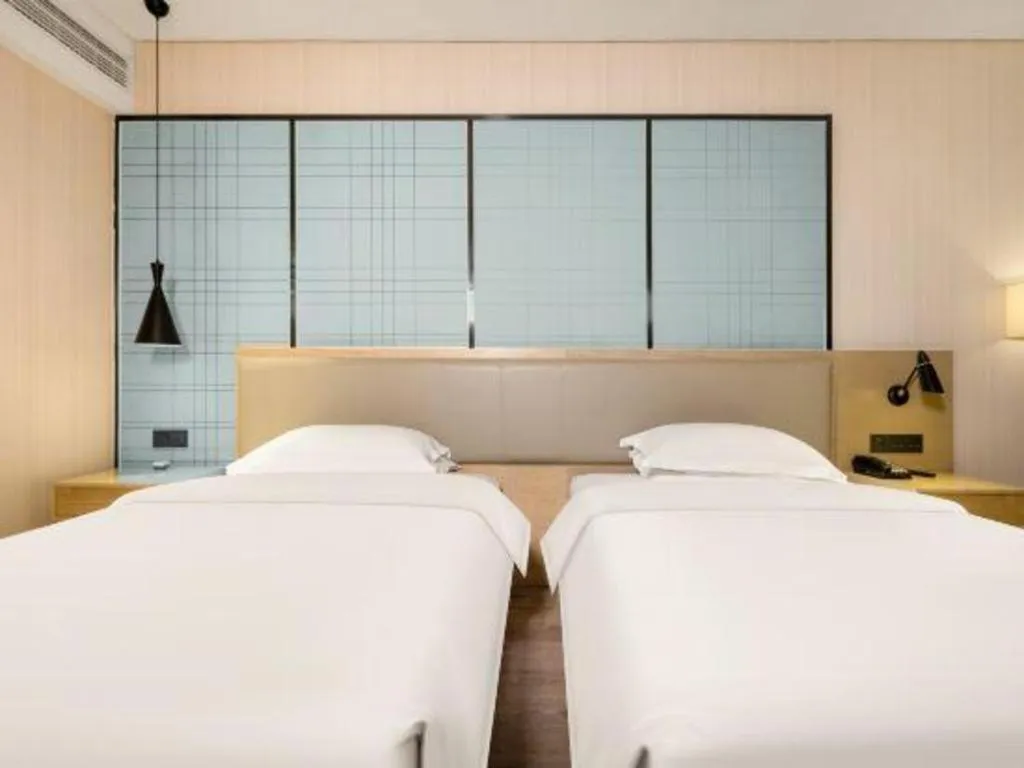 Bed in Echarm Hotel Nanning the MixC Exhibition Center Metro Station