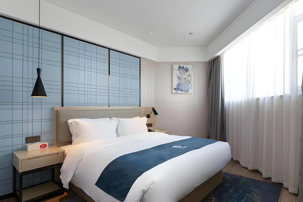 Bed in Echarm Hotel Nanning the MixC Exhibition Center Metro Station