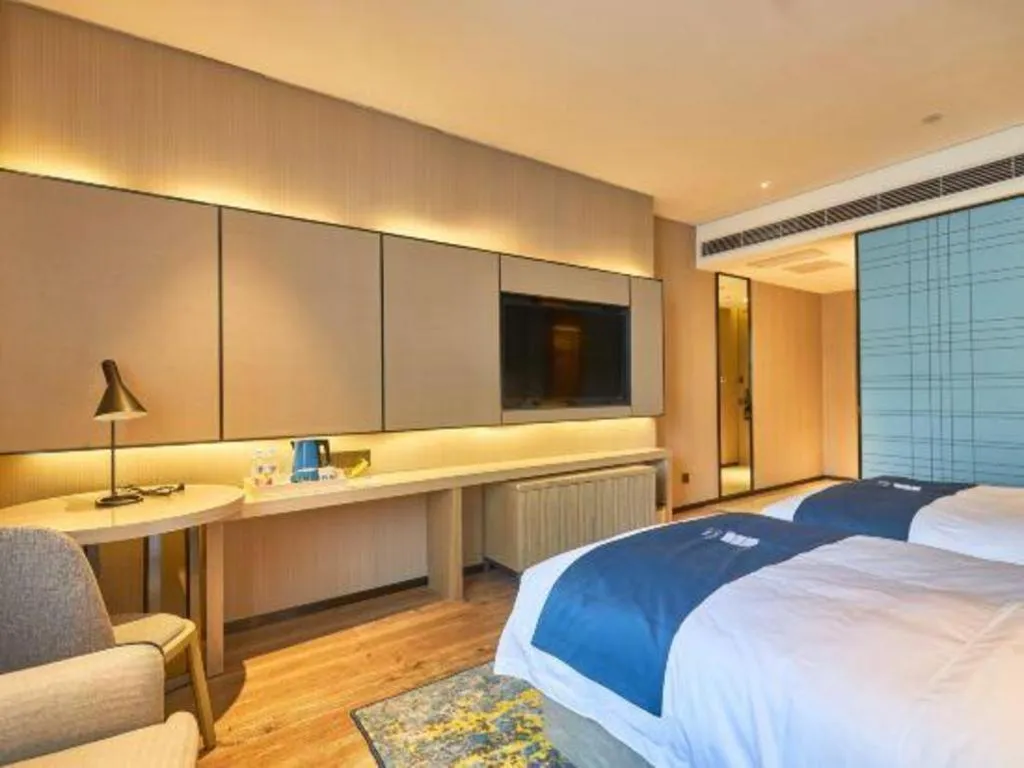 Bed in Echarm Hotel Liuzhou High-speed Railway Station