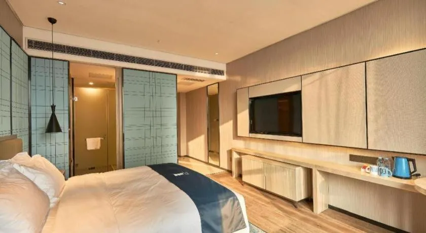 Bed in Echarm Hotel Liuzhou High-speed Railway Station