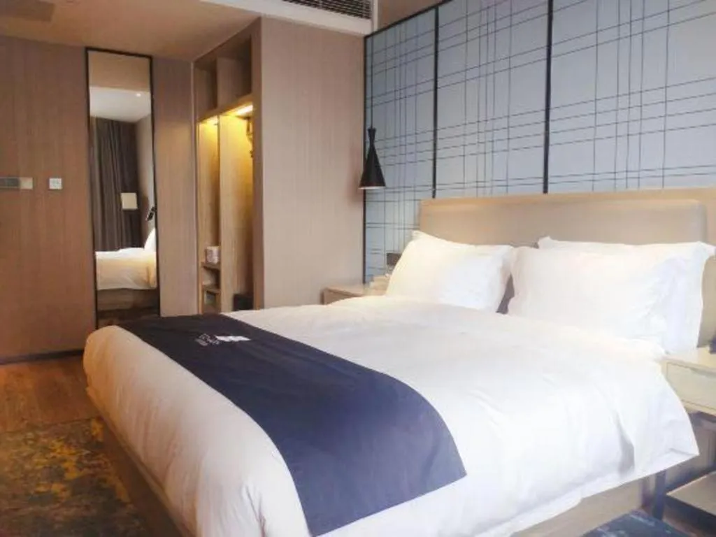 Bed in Echarm Hotel Liuzhou High-speed Railway Station