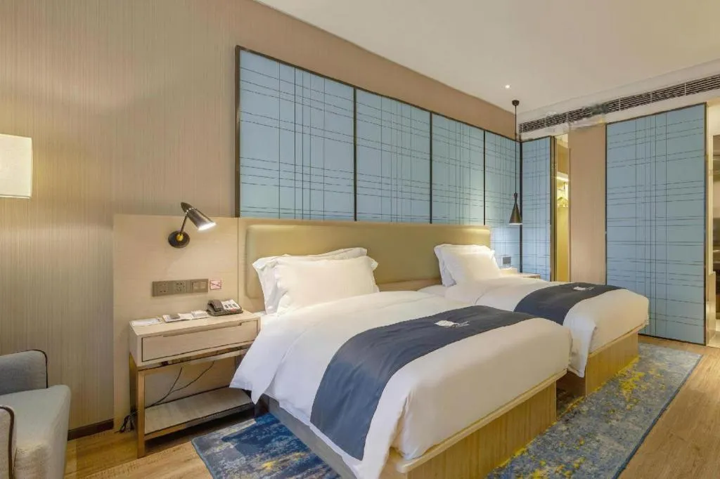 Bed in Echarm Hotel Liuzhou High-speed Railway Station