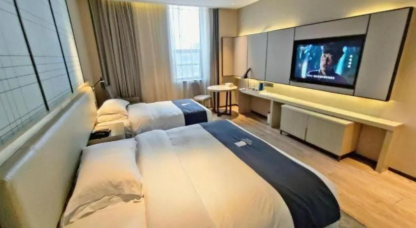 Bed in Echarm Hotel Liuzhou High-speed Railway Station