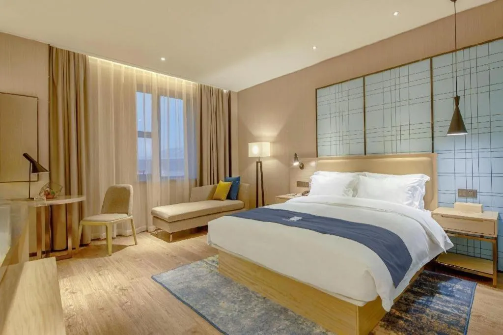 Bed in Echarm Hotel Liuzhou High-speed Railway Station