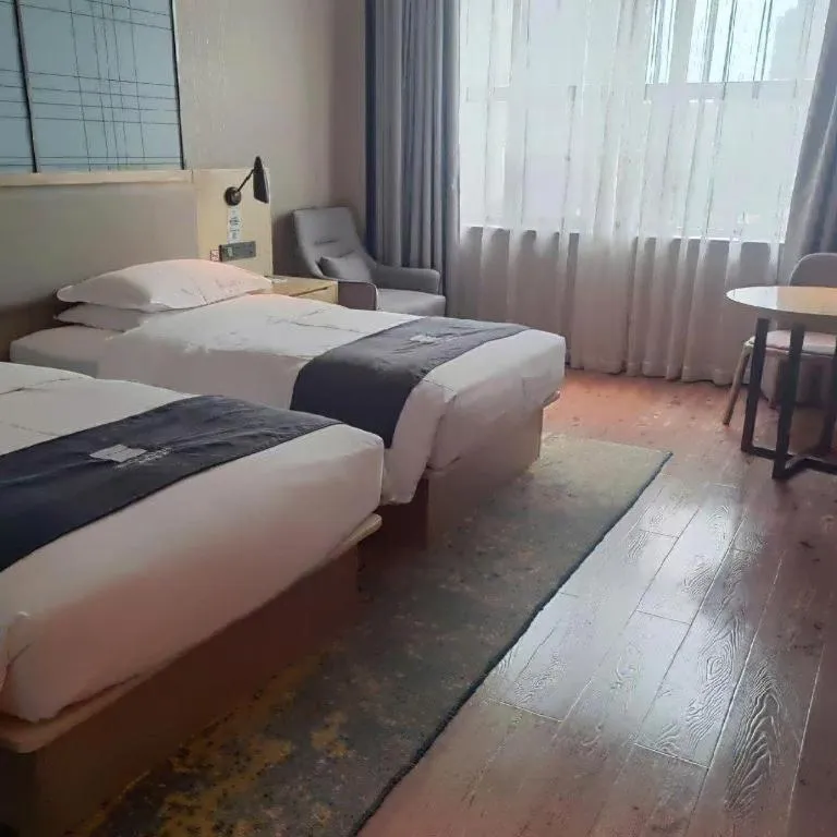 Bed in Echarm Hotel Liuzhou High-speed Railway Station