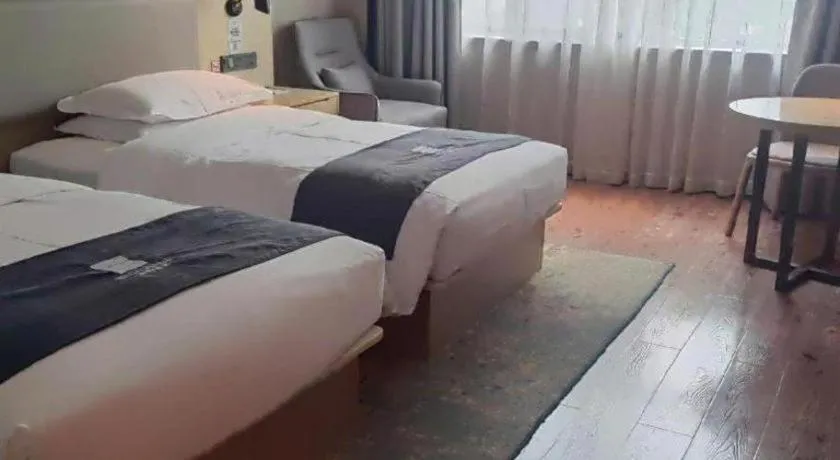 Bed in Echarm Hotel Liuzhou High-speed Railway Station
