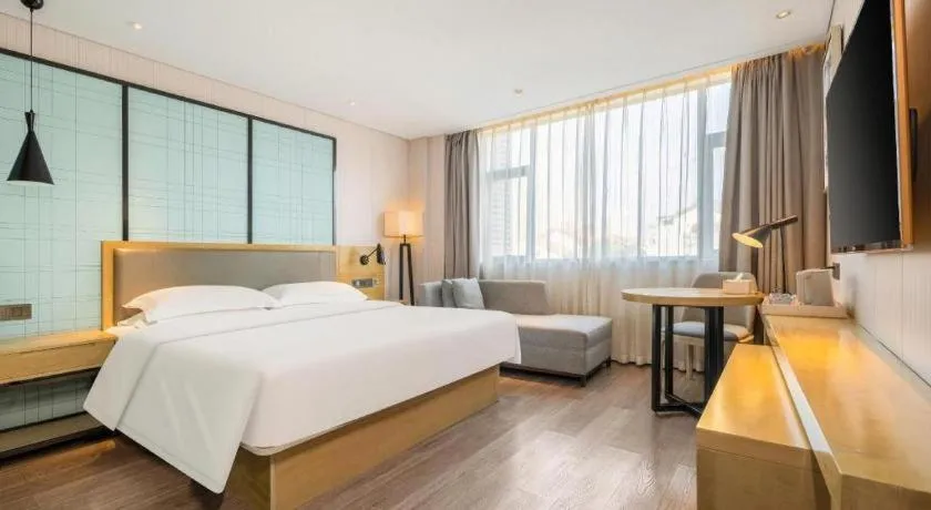 Bed in Echarm Hotel Nanning Qingxiu Mountain