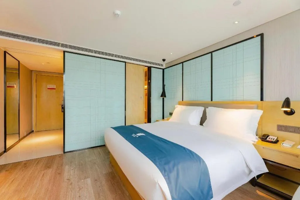 Bed in Echarm Hotel Nanning Qingxiu Mountain
