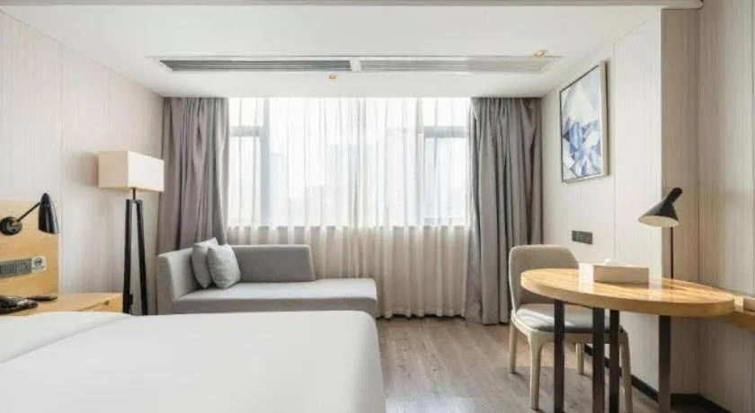 Bed in Echarm Hotel Nanning Qingxiu Mountain