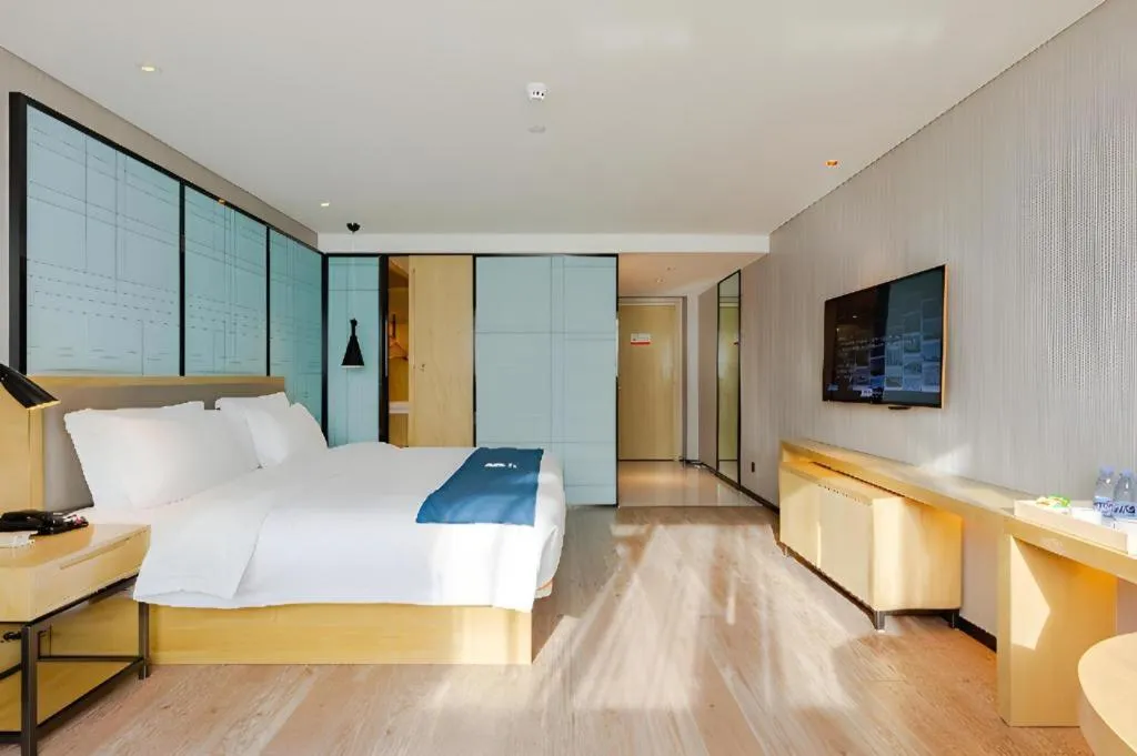 Bed in Echarm Hotel Nanning Qingxiu Mountain