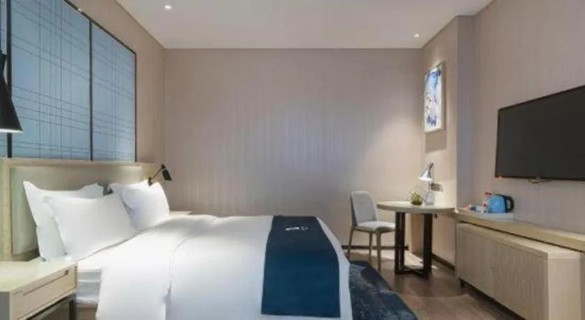 Bed in Echarm Hotel Nanning Qingxiu Mountain