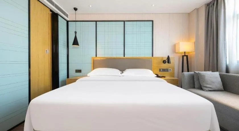 Bed in Echarm Hotel Nanning Qingxiu Mountain