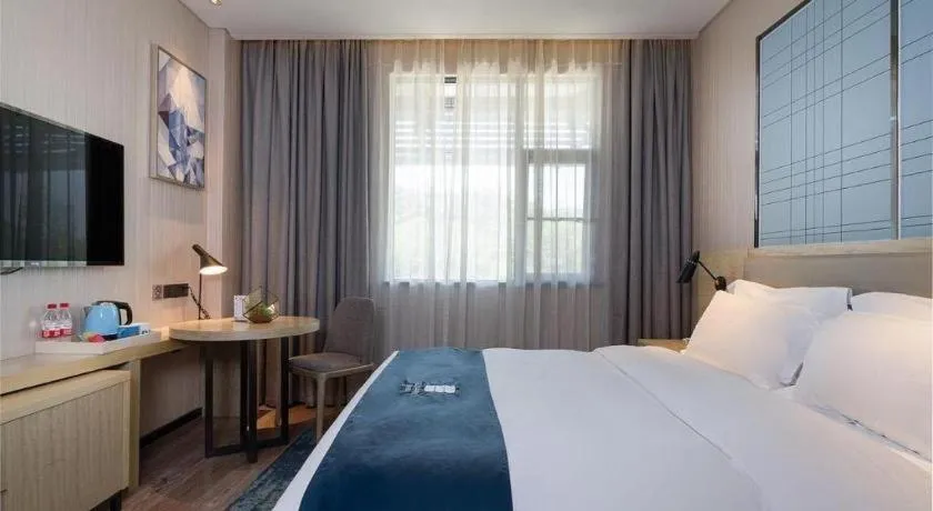 Bed in Echarm Hotel Nanning Qingxiu Mountain