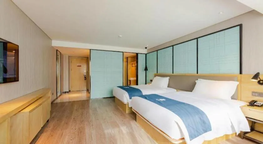 Bed in Echarm Hotel Nanning Qingxiu Mountain