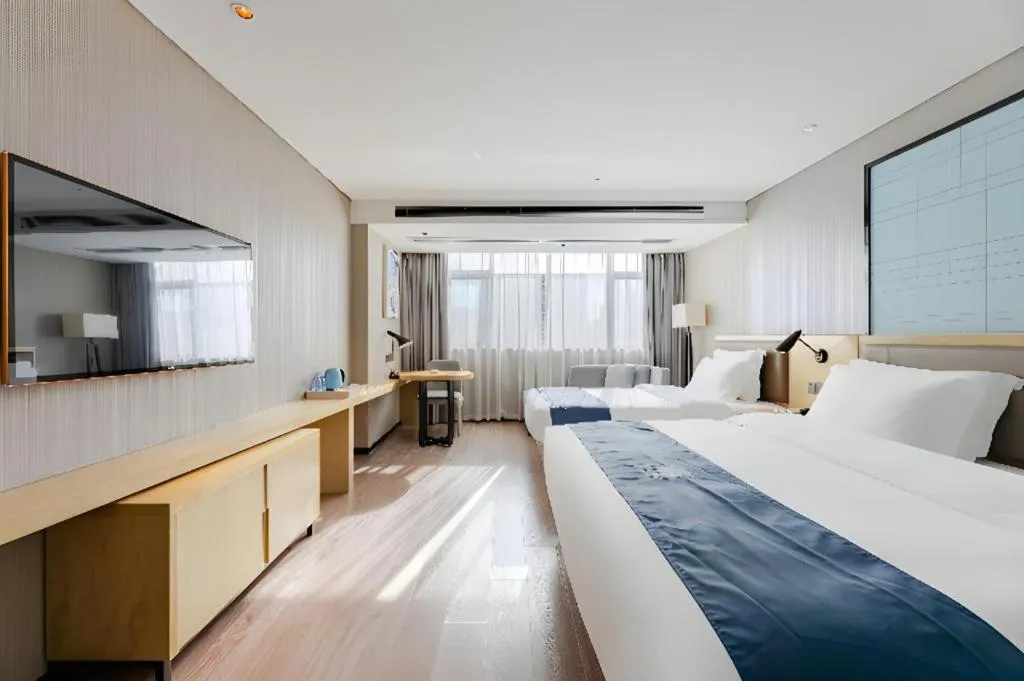 Bed in Echarm Hotel Nanning Qingxiu Mountain
