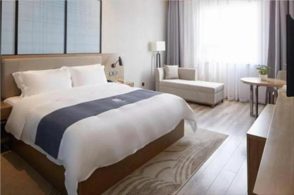 Bed in Echarm Hotel Nanning Qingxiu Mountain