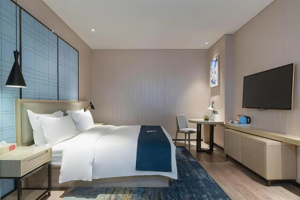 Bed in Echarm Hotel Nanning Qingxiu Mountain