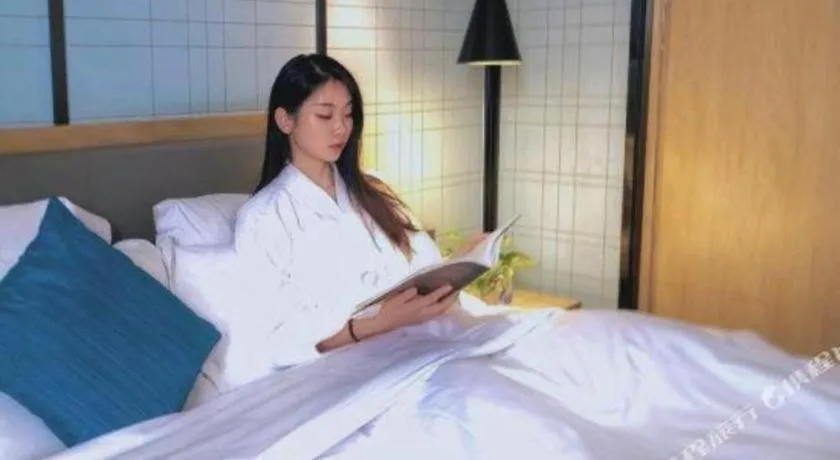 Bed in Echarm Hotel Nanning Qingxiu Mountain