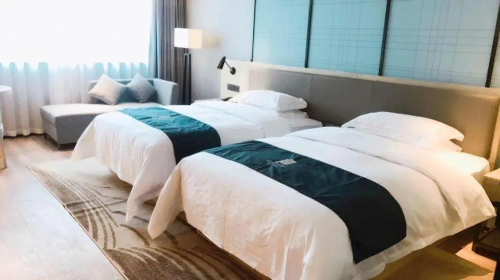 Bed in Echarm Hotel Nanning Qingxiu Mountain