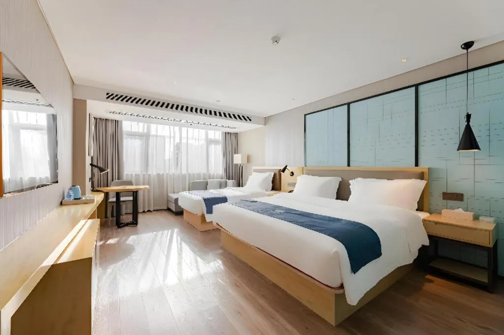Bed in Echarm Hotel Nanning Qingxiu Mountain