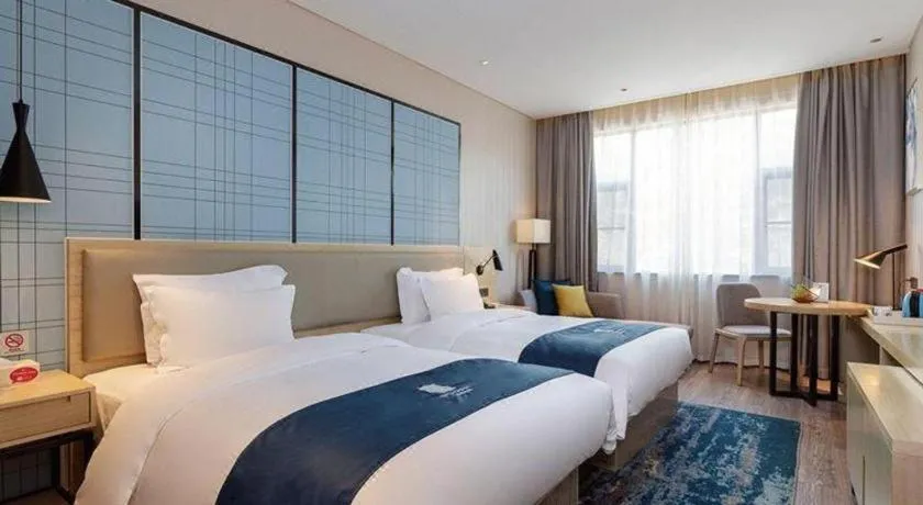 Bed in Echarm Hotel Nanning Qingxiu Mountain