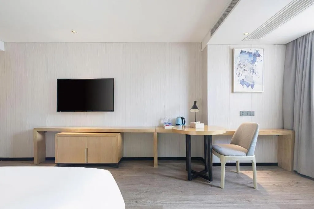 Bed in Echarm Hotel Nanning Qingxiu Mountain