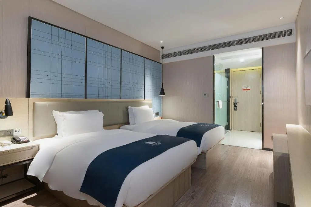 Bed in Echarm Hotel Nanning Qingxiu Mountain