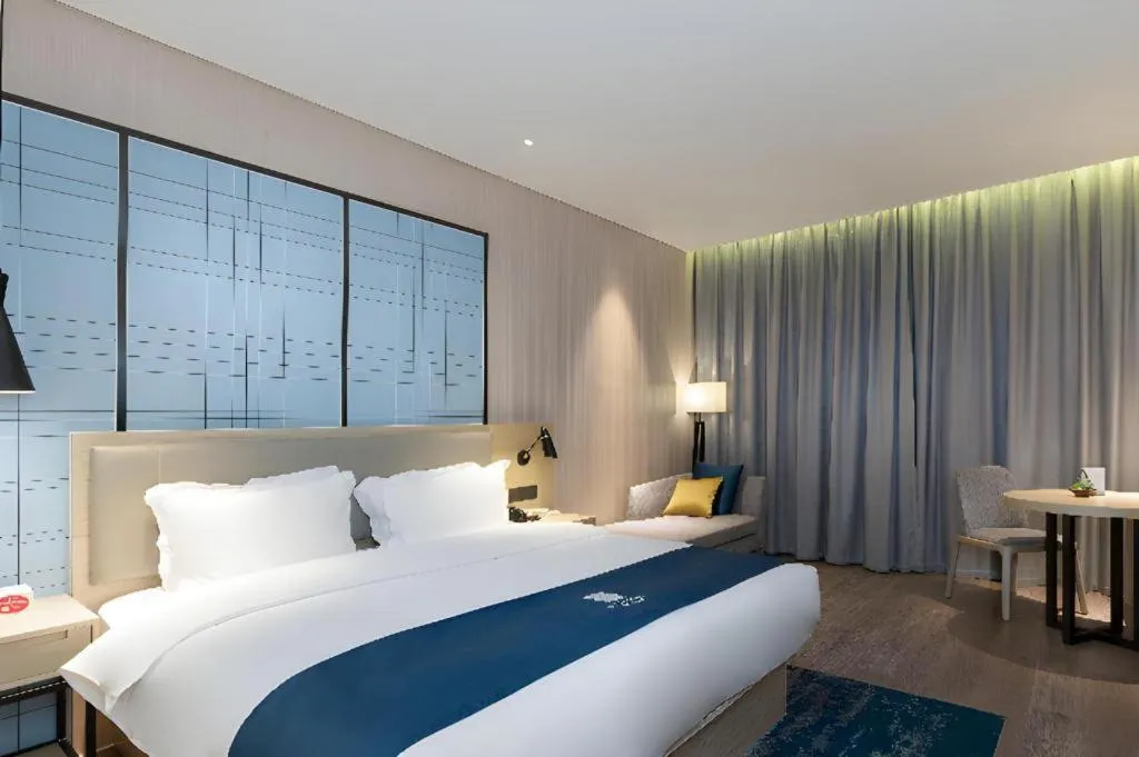 Bed in Echarm Hotel Nanning Qingxiu Mountain