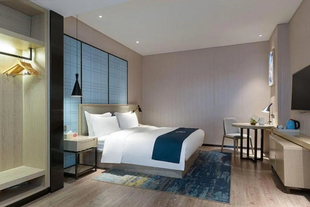 Bed in Echarm Hotel Nanning Qingxiu Mountain