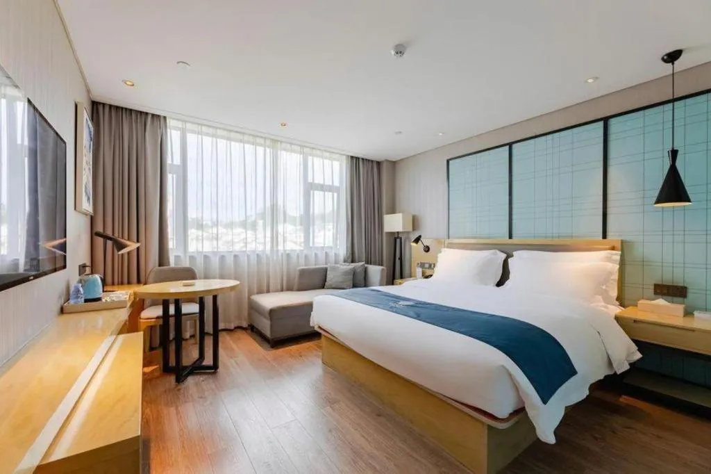 Bed in Echarm Hotel Nanning Qingxiu Mountain