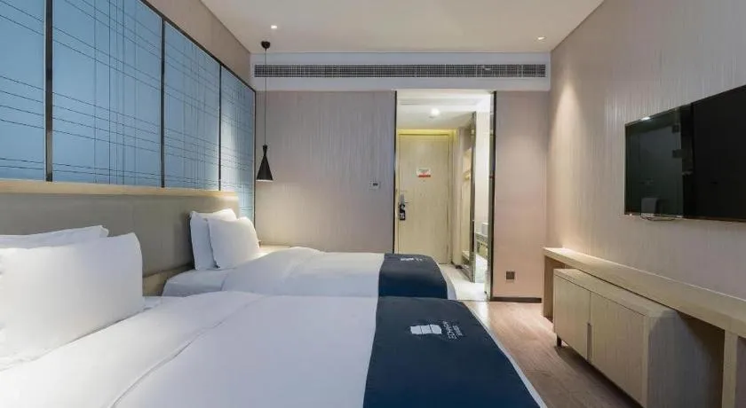 Bed in Echarm Hotel Nanning Qingxiu Mountain