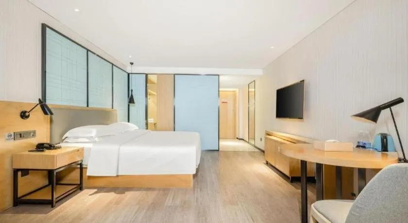 Bed in Echarm Hotel Nanning Qingxiu Mountain