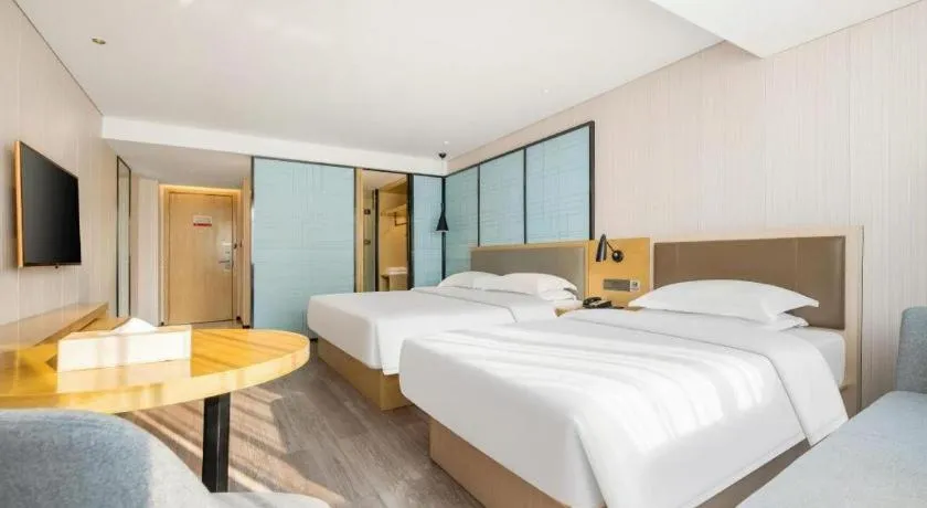 Bed in Echarm Hotel Nanning Qingxiu Mountain