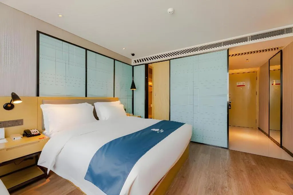 Bed in Echarm Hotel Nanning Qingxiu Mountain