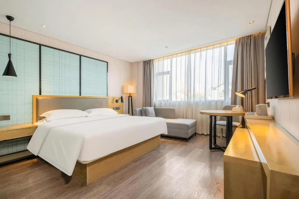 Bed in Echarm Hotel Nanning Qingxiu Mountain