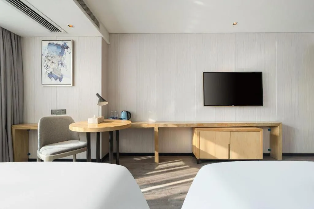 Bed in Echarm Hotel Nanning Qingxiu Mountain