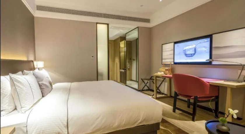 Bed in Echeng Hotel Nanning Jiangnan Wanda Baisha Avenue