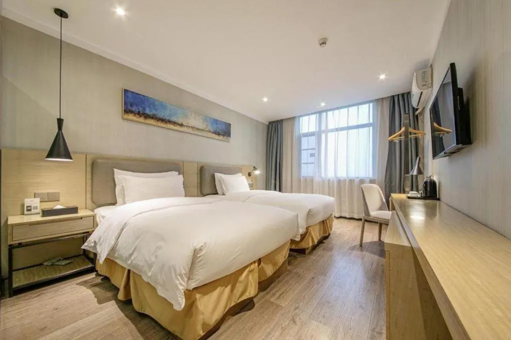 Bed in Borrman Hotel Wuhan Yangluo Metro Station Shenshuigang