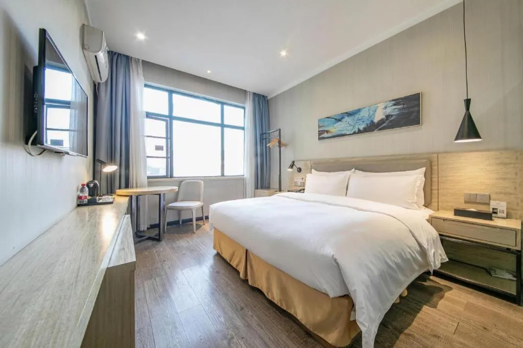 Bed in Borrman Hotel Wuhan Yangluo Metro Station Shenshuigang