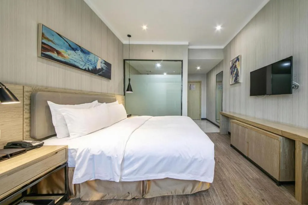 Bed in Borrman Hotel Wuhan Yangluo Metro Station Shenshuigang