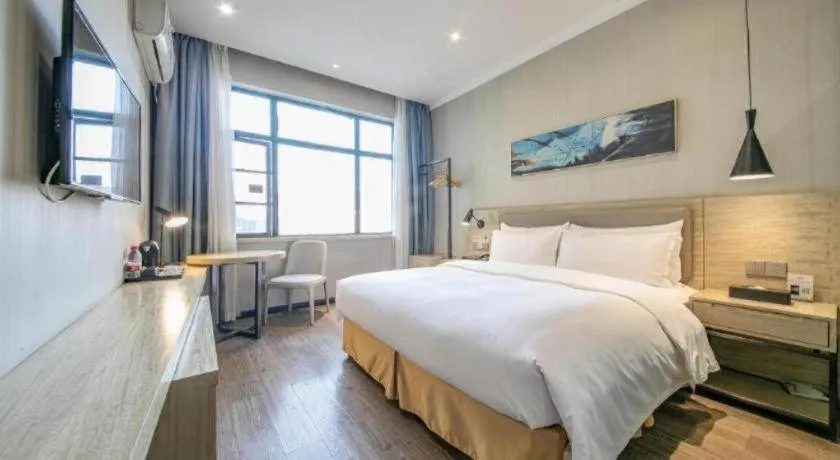 Bed in Borrman Hotel Wuhan Yangluo Metro Station Shenshuigang