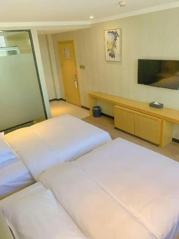 Bed in Borrman Hotel Wuhan Yangluo Metro Station Shenshuigang