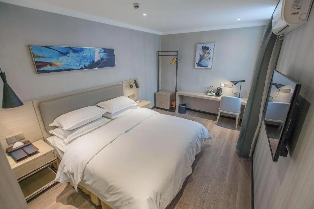 Bed in Borrman Hotel Wuhan Yangluo Metro Station Shenshuigang