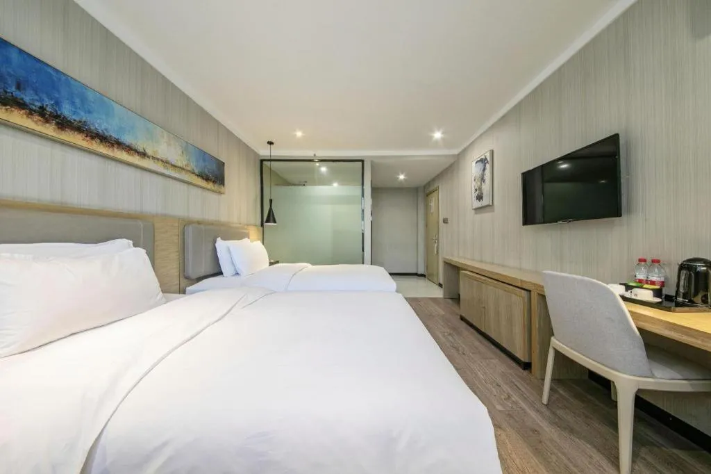 Bed in Borrman Hotel Wuhan Yangluo Metro Station Shenshuigang