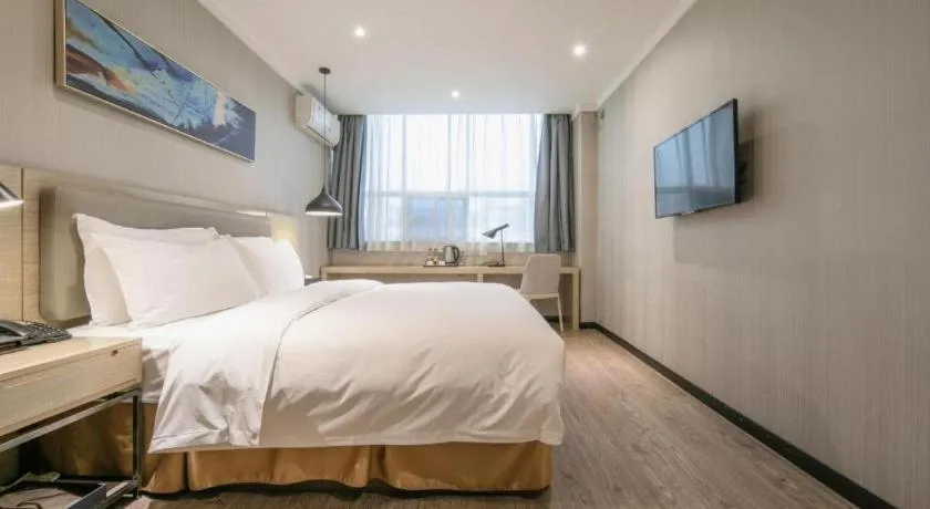 Bed in Borrman Hotel Wuhan Yangluo Metro Station Shenshuigang