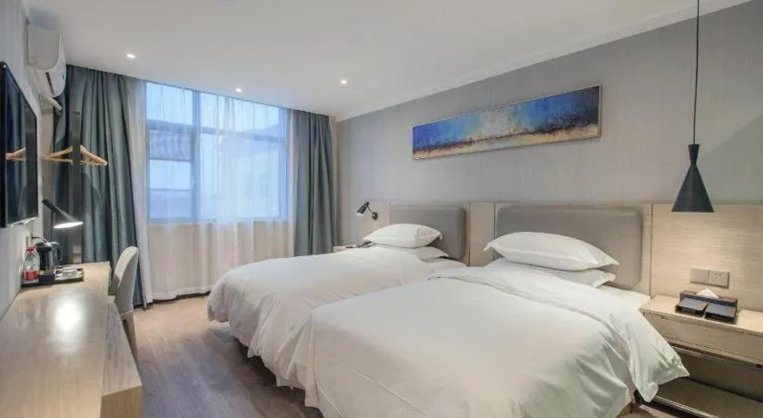 Bed in Borrman Hotel Wuhan Yangluo Metro Station Shenshuigang