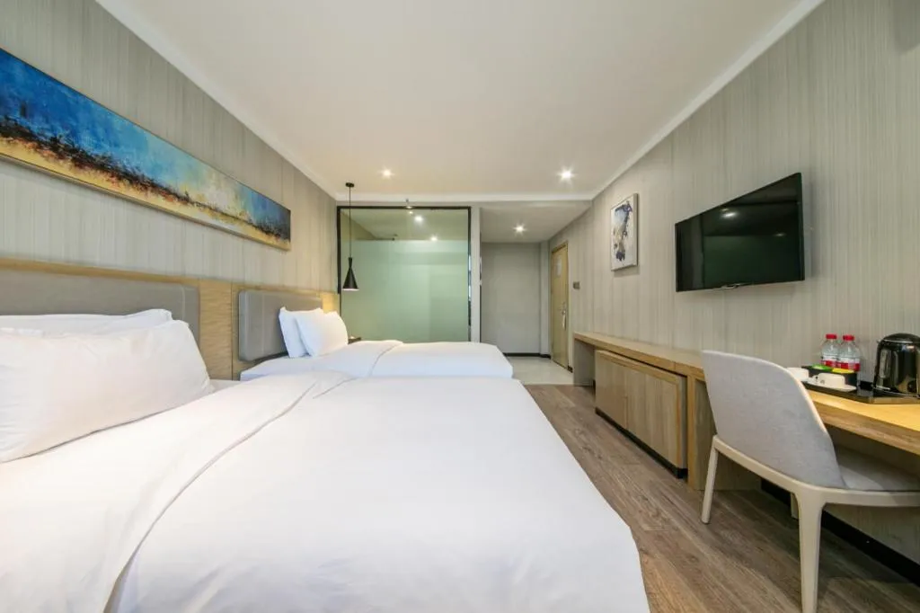 Bed in Borrman Hotel Wuhan Yangluo Metro Station Shenshuigang